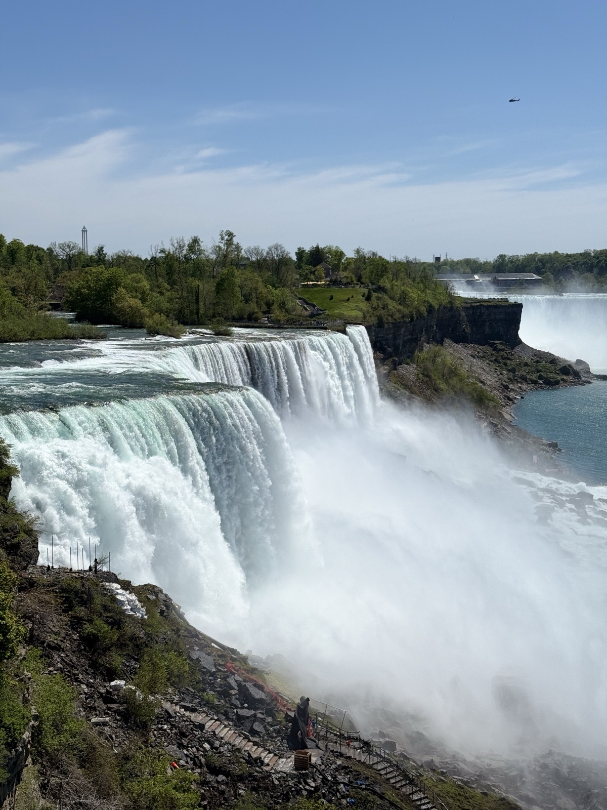 Niagara Falls thundering into mist, Horseshoe Falls visible across the gorge